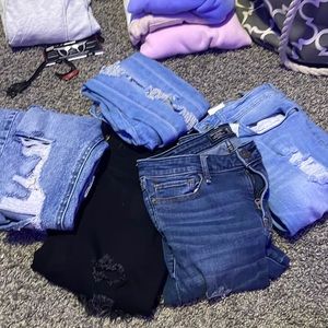 5 pairs of different brands and sizes of pants
